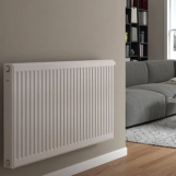 Радіатор сталевий  Compact Panel 11  TEK  500 x 1200 мм  1299 Ват  бокове підключення  DeLonghi Фото - 1